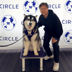 Ori Borjigin with Dubs in front of a banner that says Circle