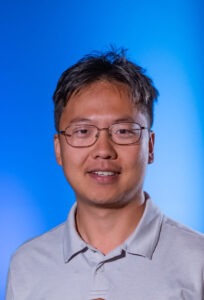 headshot of Ori Borjigin in front of blue background
